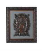 A Victorian carved and stained hardwood armorial plaque