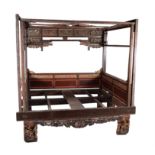 A Chinese lacquered and parcel gilt "opium" bed frame