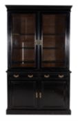 A Victorian ebonised cabinet bookcase