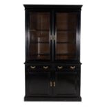 A Victorian ebonised cabinet bookcase