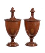 A pair of mahogany and chequer inlaid knife urns and covers in George III style