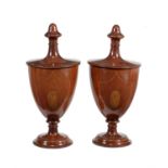 A pair of mahogany and chequer inlaid knife urns and covers in George III style