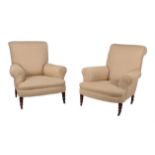 A pair of late Victorian oak and 'oatmeal' upholstered armchairs