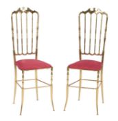 A pair of brass side chairs