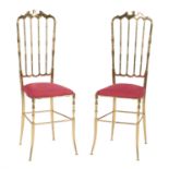 A pair of brass side chairs