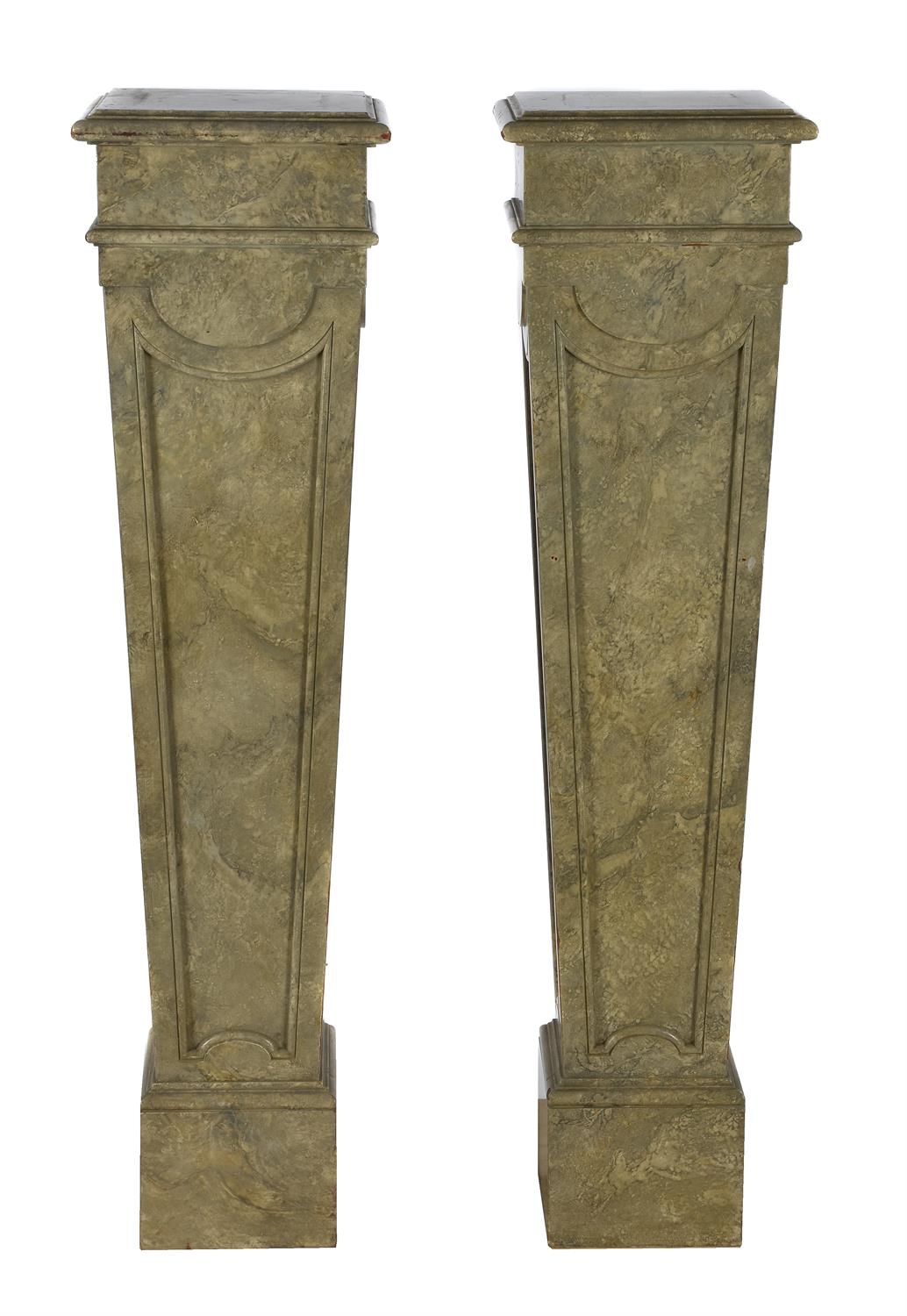 A pair of simulated marble pedestals