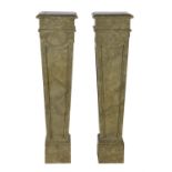 A pair of simulated marble pedestals