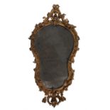 A giltwood and composition wall mirror