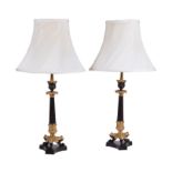 A pair of French gilt and lacquered metal candlesticks in Louis Philippe taste refitted as lamps