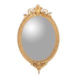 A mid-Victorian giltwood and composition oval wall mirror