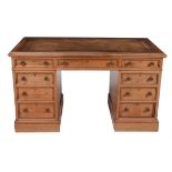 A Victorian walnut pedestal desk with inset leather writing surface