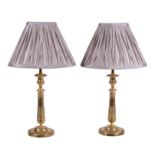 A pair of French gilt metal candlesticks in Empire style