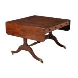 A Regency mahogany and ebony inlaid sofa table