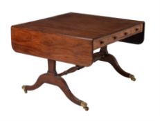 A Regency mahogany and ebony inlaid sofa table