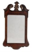 A George II mahogany and parcel gilt wall mirror