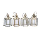 A set of four gilt metal and glazed hexagonal hall lanterns