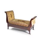 A mahogany and upholstered day bed in Empire style