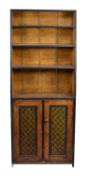 A grained pine and ebonised bookcase side cabinet