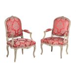 A pair of green painted Louis XV armchairs