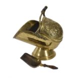 A late Victorian repoussé brass coal scuttle