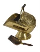 A late Victorian repoussé brass coal scuttle