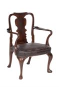 A walnut and leather upholstered armchair