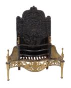 A wrought and cast iron and brass mounted fire grate