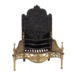 A wrought and cast iron and brass mounted fire grate