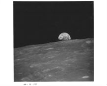 Apollo 8. Earth rising above the Moon's horizon