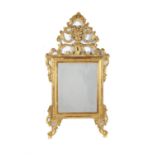 An Italian giltwood and composition wall mirror