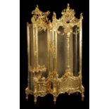 A carved giltwood vitrine