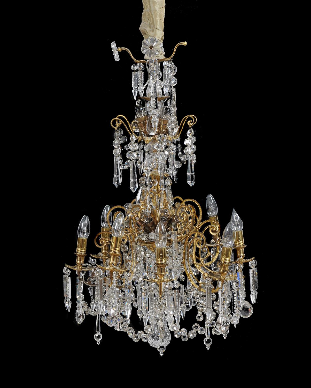 A gilt metal and cut glass eight branch chandelier in Louis XV style 19th century