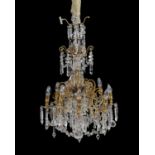 A gilt metal and cut glass eight branch chandelier in Louis XV style 19th century