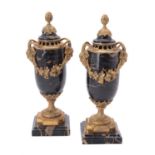 A pair of French flecked black marble and gilt metal mounted vases