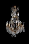 A cut and moulded glass and gilt metal sixteen-light chandelier in Louis XV style