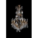 A cut and moulded glass and gilt metal sixteen-light chandelier in Louis XV style