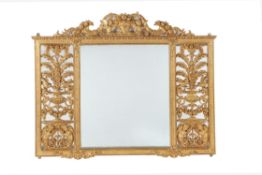 A Continental carved giltwood wall mirror in the German Baroque manner