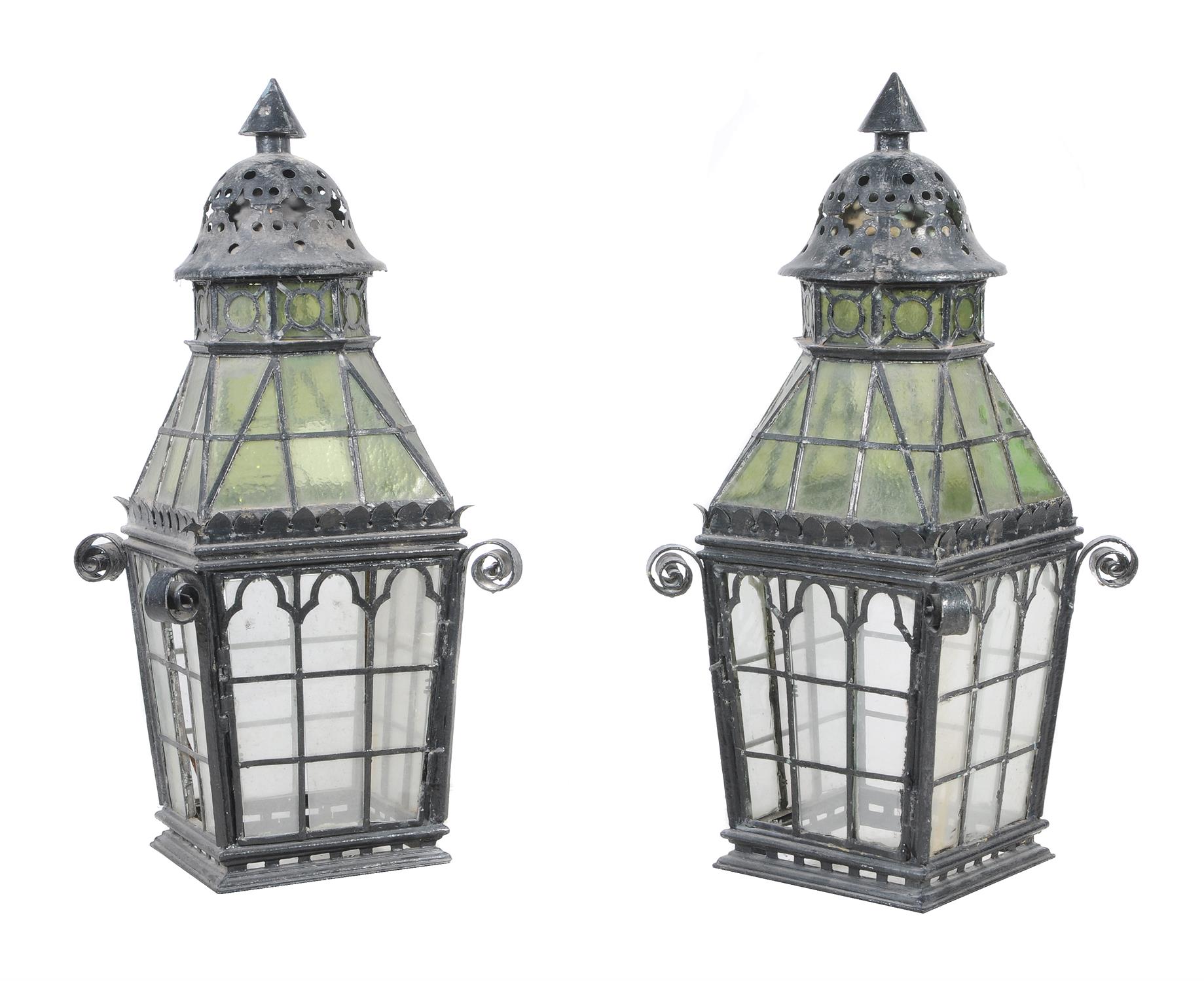 A pair of late Victorian black-painted cast-iron metal and glazed lanterns