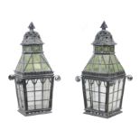 A pair of late Victorian black-painted cast-iron metal and glazed lanterns