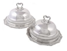 A pair of late George III silver shaped circular vegetable dishes and covers by William Stroud