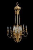 A Belle Epoque gilt metal and frosted glass seven light chandelier