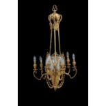 A Belle Epoque gilt metal and frosted glass seven light chandelier