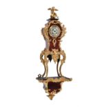 Y A French gilt metal and scarlet tortoiseshell mantel clock in Rococo style