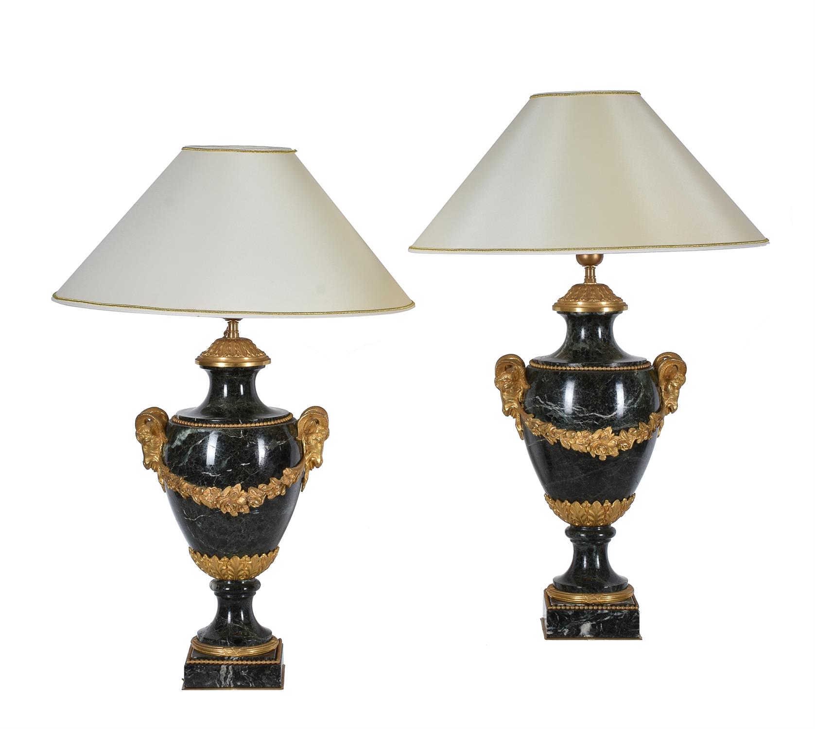 A pair of French green serpentine marble and gilt metal mounted table lamps in Louis XVI style