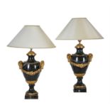 A pair of French green serpentine marble and gilt metal mounted table lamps in Louis XVI style