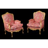 A pair of French giltwood bergeres armchairs in Louis XV style
