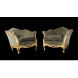 A pair of carved giltwood tub chairs