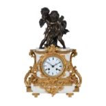 A late 19th century French white marble, ormolu and bronze mounted mantel clock