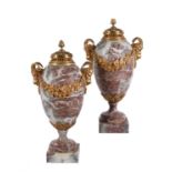 A pair of French Brocatelle marble and gilt metal mounted urns in Louis XVI style