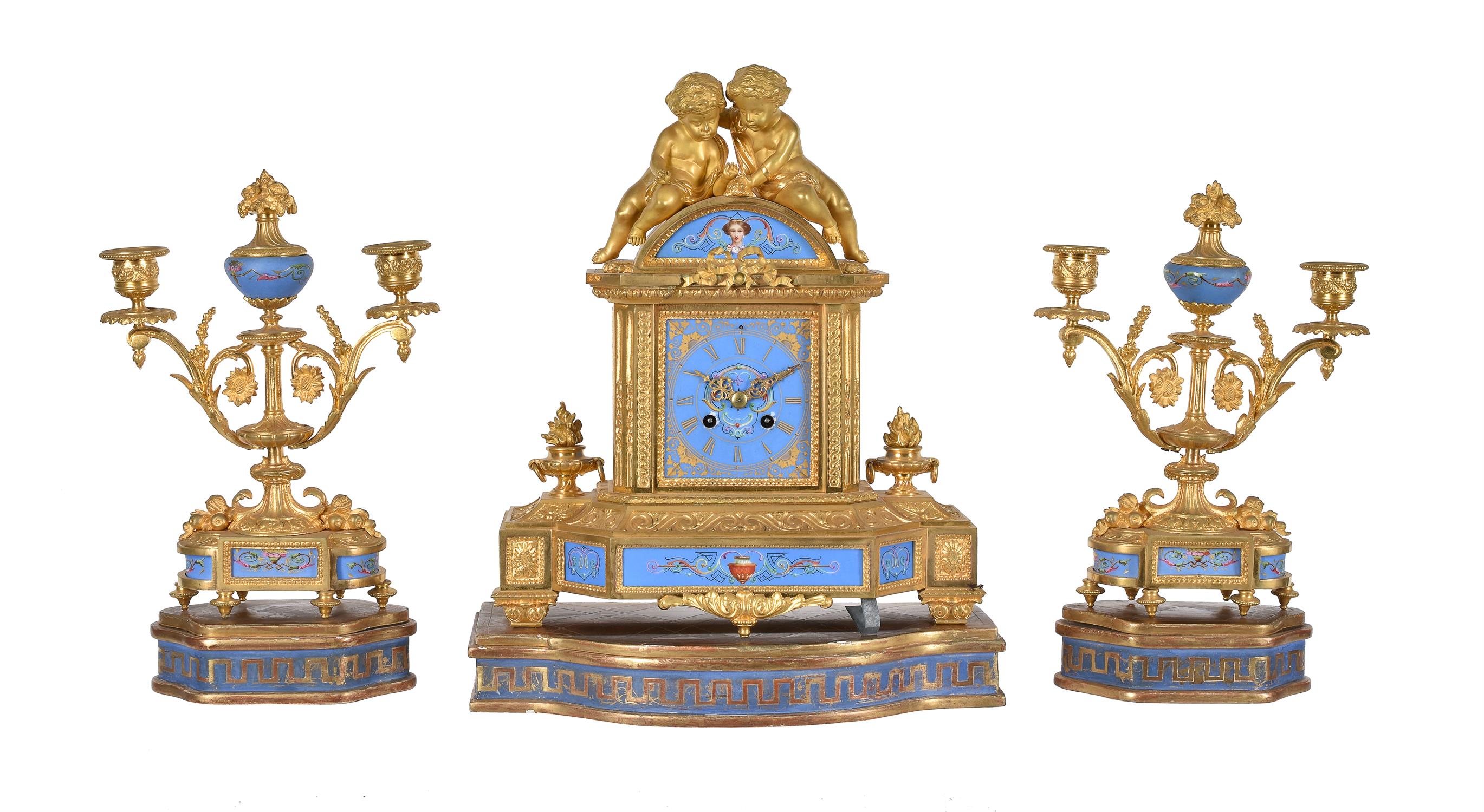 A French Sevres style porcelain and gilt metal mounted clock garniture Japy Frères